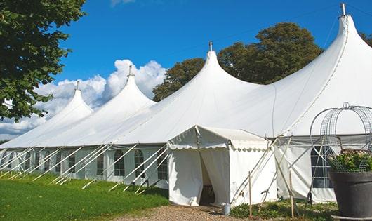 multiple portable restrooms in a row for added convenience at a concert venue in Dorchester Center